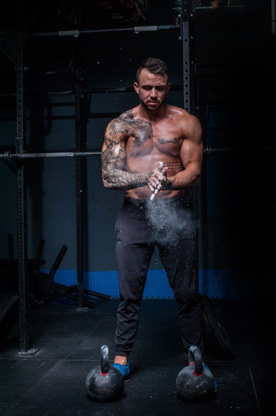 Man lacing his shoes before a workout.