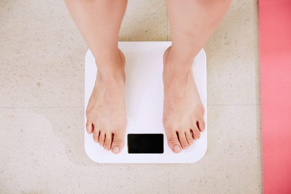 Bathroom scale on a tiled floor.
